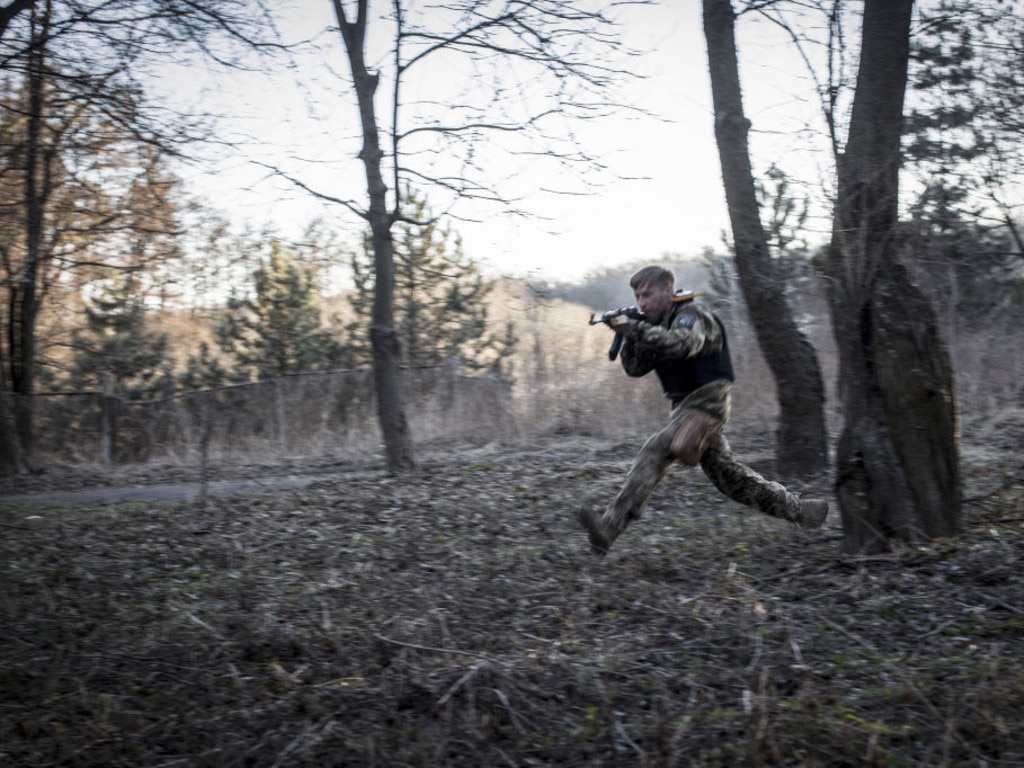 A volunteer civilian practices combat tactics during a military training in Kyiv. The US has remained adamant against sending troop to Ukraine but has committed to over $1b in provisions for the local military.