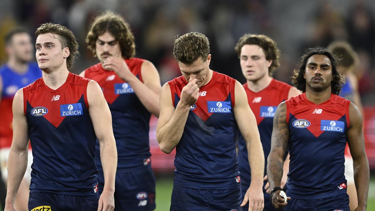 Melbourne players leave the field after what was likely Luke Jackson’s final game in red and blue. Picture: Getty Images