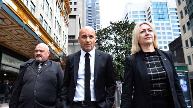 Former NSW detective Gary Jubelin, centre, leaves the Downing Centre Local Court in Sydney. Picture: AAP.