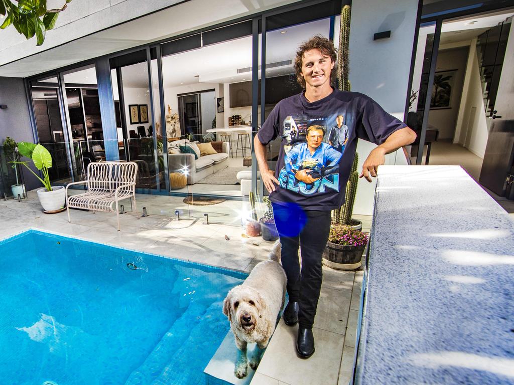 Cam McEvoy first started investing in cryptocurrency in 2017. Pictured at his house with his dog Apollo. Picture: NIGEL HALLETT