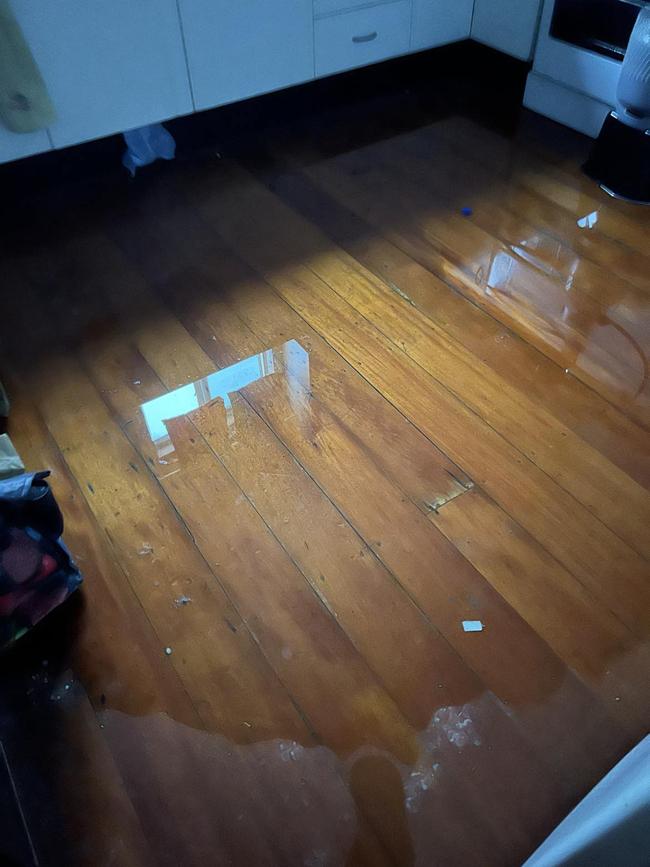 Water leaking through the second storey floorboards of the two-storey rental home on Fairford Rd, Ingham, during the Hinchinbrook severe weather and flooding disaster in early February. Picture: Cameron Bates