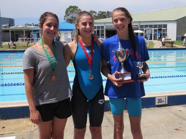 Jewish swimming championships — Medallists for the women's 100m freestyle: (from left) bronze winner Mikaela Rifkin, 18, from St Ives; silver winner Brooke Roseman, 13, from Melbourne; and Cup winner Maya Murphy, 13. Picture: Supplied.