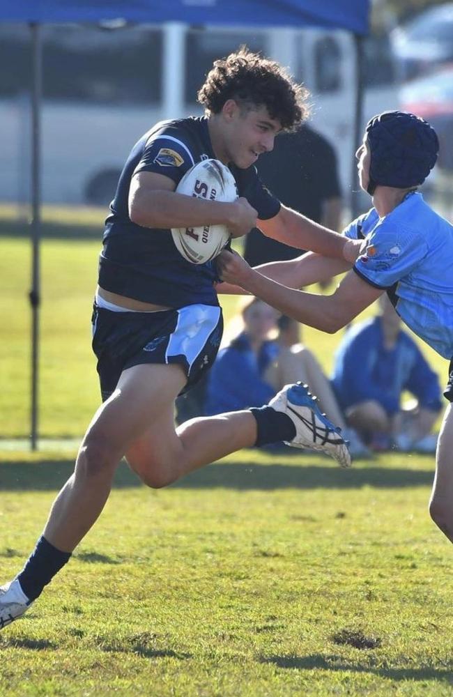 Caloundra State High School Halfback Tully McLellan breaks the tackle of a Mabel Park defender. Picture: Contributed