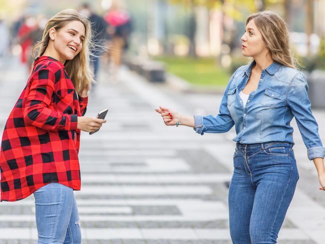 Young Female Friends are Walking Through the City District and Enjoying the Time Together.