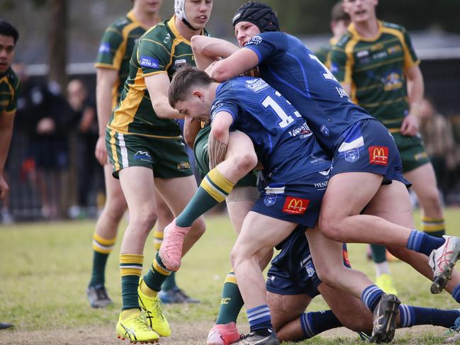 Brothers swarm in defence. Photographer: Warren Gannon Photography