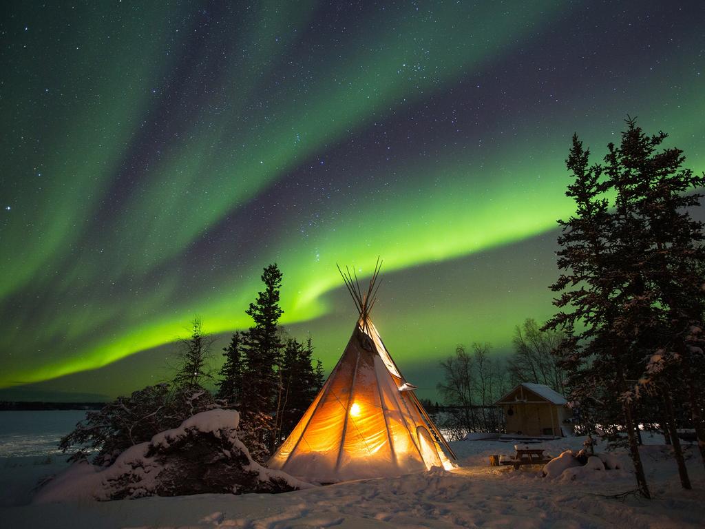 Image Name: When The Sky Lights Up Photographer Name: Nicky Loh Year: 2018 Image Description: A traditional native tepee lights up at B Dene in Yellowknife during an aurora showing on New Years Day January 1, 2017. Copyright: Nicky Loh, 3rd place, Singapore National Award. Picture: Sony World Photography Awards/ Nicky Loh