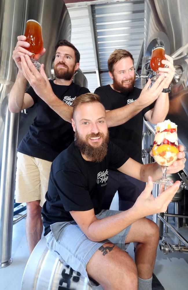 Dan Norris, Eddie Oldfield and Michael McGovern in 2016 with their trifle-inspired beer. Photo: Richard Gosling