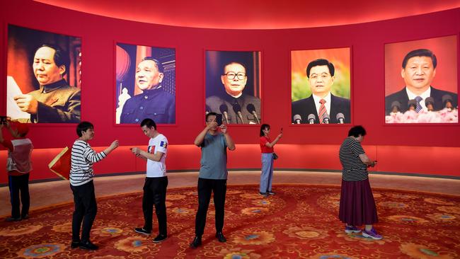 President Xi Jinping, far right, praises Mao, left, and seeks to emulate him. Picture: AFP