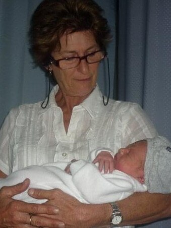 Sue Duffy pictured holding one of her grandchildren.