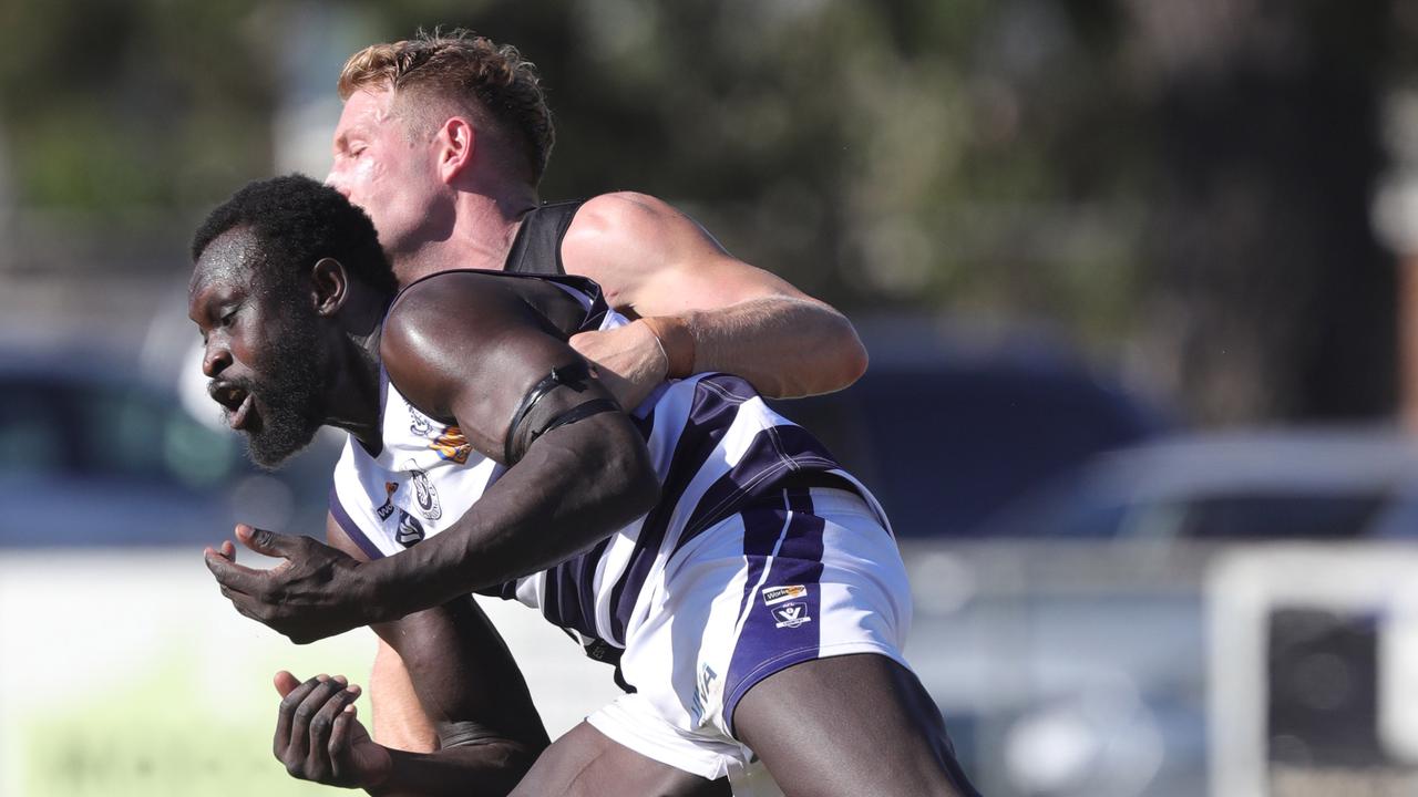 Lara recruit Majak Daw is tackled by St Albans’ Hayden Elliot. Picture: Mark Wilson