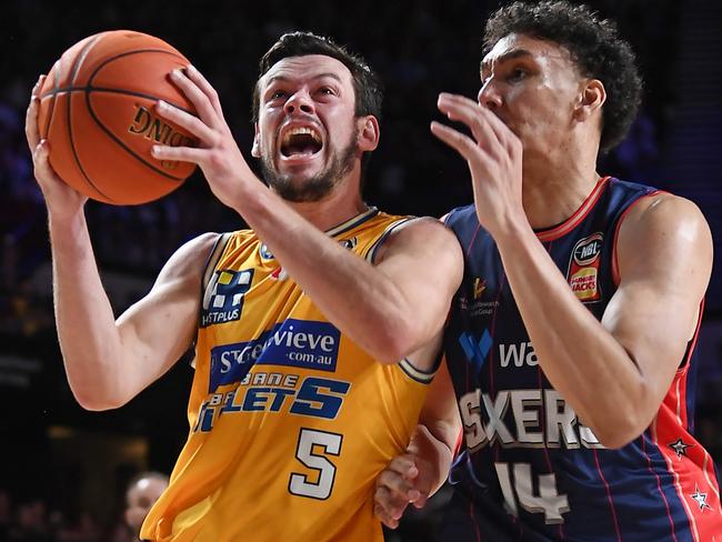 ADELAIDE, AUSTRALIA - DECEMBER 29:  Jason Cadee of the Brisbane Bullets competes with Kyrin Galloway of the 36ers during the round 13 NBL match between Adelaide 36ers and Brisbane Bullets at Adelaide Entertainment Centre, on December 29, 2022, in Adelaide, Australia. (Photo by Mark Brake/Getty Images)