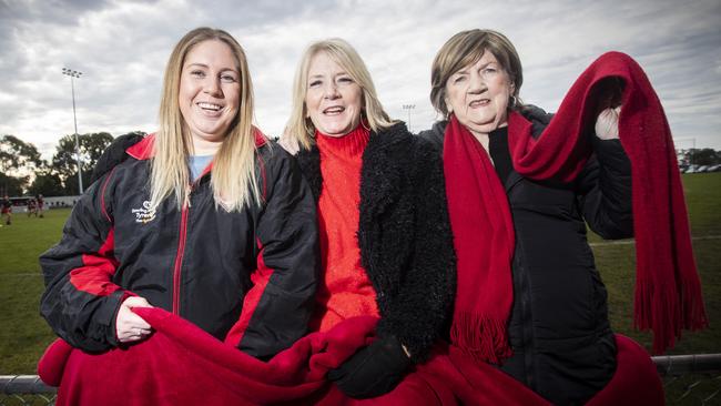 Family members of Lauderdale co-captain Bryce Walsh, from left, Tahlia Walsh, Kim Walsh and Rose Ewington at the footy to cheer on the Bombers. Picture: LUKE BOWDEN