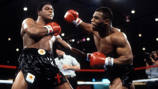 Mike Tyson dominated (R) Trevor Berbick to win the WBC heavyweight title. (Photo by: The Ring Magazine via Getty Images)