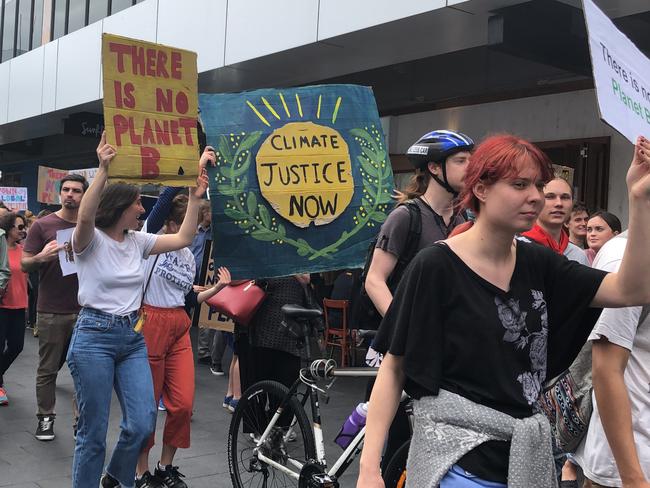 Protesters march through Crown Street Mall.