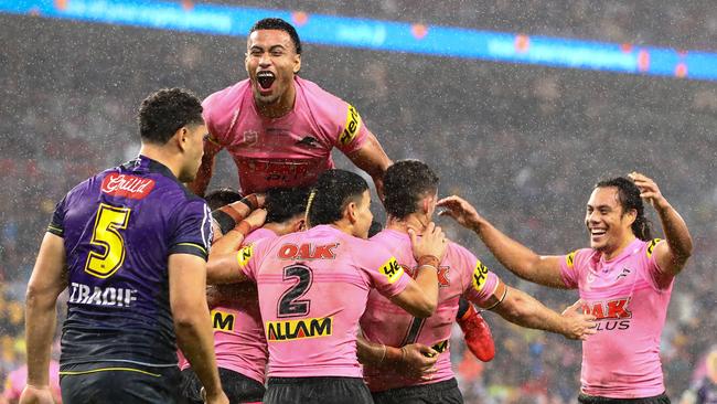 The Panthers celebrate one of their five tries against the Storm on Saturday night. Picture: Chris Hyde/Getty Images