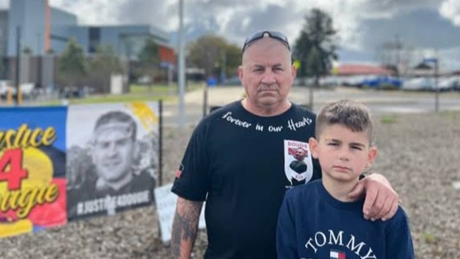 Rick Hampson Snr with Dougie’s nephew Tatum rallying in front of the Dubbo Base Hospital.