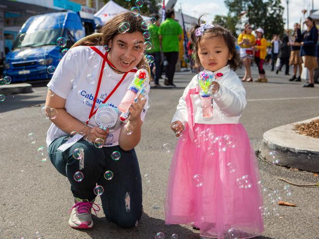 Diana Barolomei, a volunteer, and Isla (2) at the Cabramatta Moon Festival in 2018. Picture: Jordan Shields.