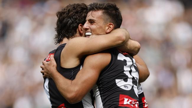 MELBOURNE, AUSTRALIA - MARCH 25: Josh Daicos and Nick Daicos of the Magpies celebrate a goal during the round two AFL match between Collingwood Magpies and Port Adelaide Power at Melbourne Cricket Ground, on March 25, 2023, in Melbourne, Australia. (Photo by Darrian Traynor/Getty Images)