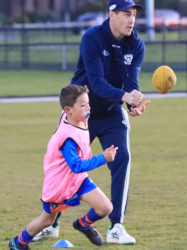 Geelong superstar Jeremy Cameron with an Armstrong Creek junior in 2023. Picture: Mark Wilson