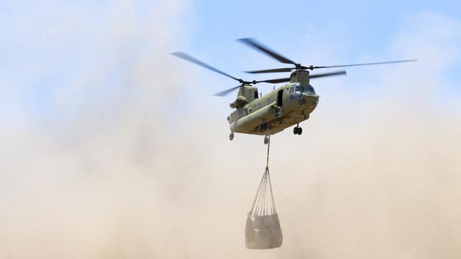 Australian Army CH-47 Chinooks deliver hay bales to remote bushfire affected farms on Kangaroo Island. Picture: AAP Image/Supplied by Department of Defence, Tristan Kennedy