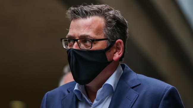 Daniel Andrews wearing a mask arrives for a press conference. Picture: Asanka Ratnayake