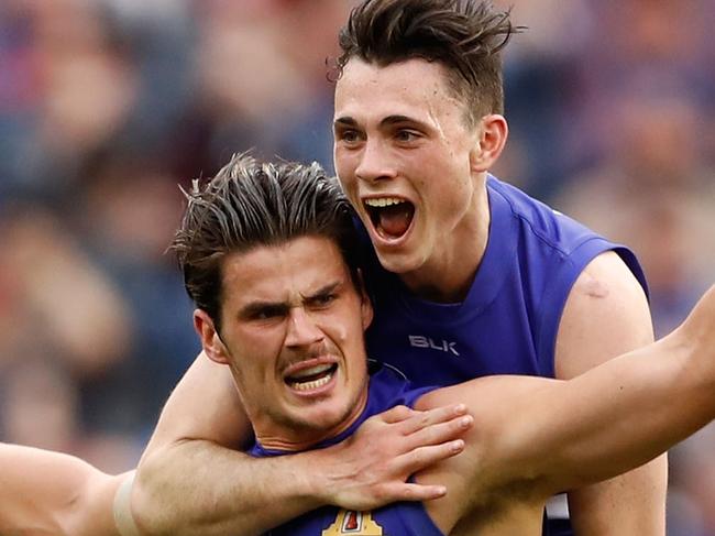 MELBOURNE, AUSTRALIA - OCTOBER 01: Tom Boyd of the Bulldogs celebrates a goal with Toby McLean of the Bulldogs during the 2016 Toyota AFL Grand Final match between the Sydney Swans and the Western Bulldogs at the Melbourne Cricket Ground on October 01, 2016 in Melbourne, Australia. (Photo by Adam Trafford/AFL Media/Getty Images)