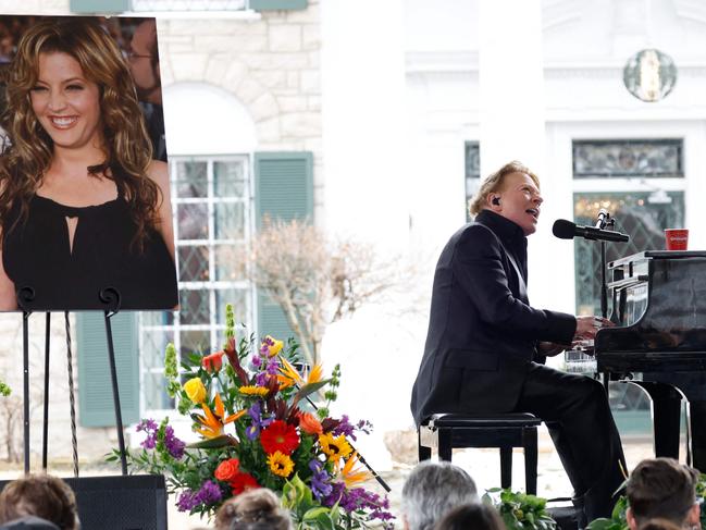 Axl Rose performs November Rain at the public memorial. Picture: Getty Images via AFP