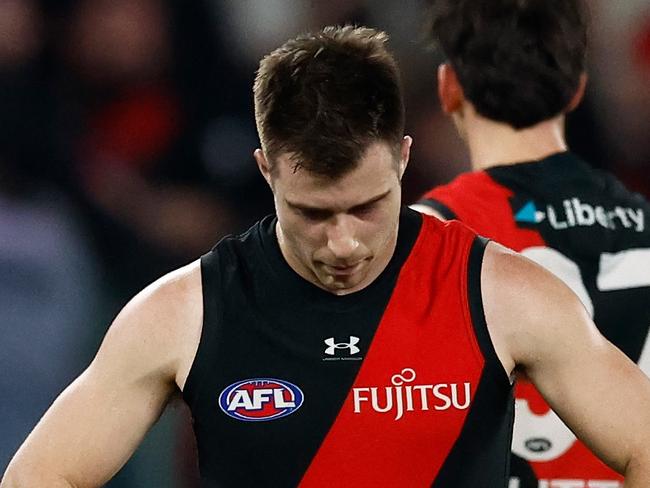 MELBOURNE, AUSTRALIA - AUGUST 10: Zach Merrett of the Bombers looks dejected after a loss during the 2024 AFL Round 22 match between the Essendon Bombers and the Gold Coast SUNS at Marvel Stadium on August 10, 2024 in Melbourne, Australia. (Photo by Michael Willson/AFL Photos via Getty Images)