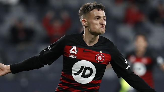 Jordan O'Doherty celebrates after scoring his teams second goal during the A-League match against Melbourne Victory.