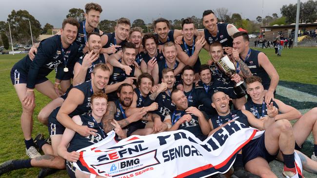 Berwick players strike a premiership pose after winning the 2018 SEFNL flag. Picture: Chris Eastman