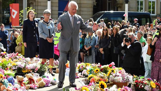 King Charles reacts as he views tributes following the July 29 attack at a children's' dance party in Southport. Picture: Peter Powell/AFP