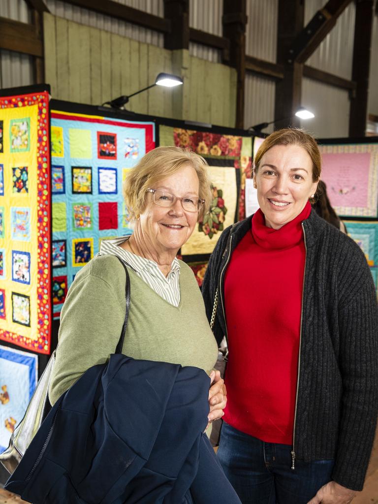 Anneke Schrale and daughter-in-law Rebecca Schrale admire the Toowoomba Quilters Club work on show at Craft Alive at the Goods Shed, Sunday, May 22, 2022. Picture: Kevin Farmer