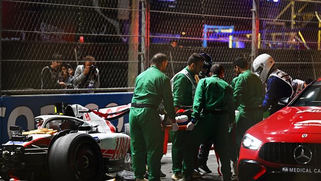 Mick Schumacher of Germany and Haas F1 is extracted from his car after a crash