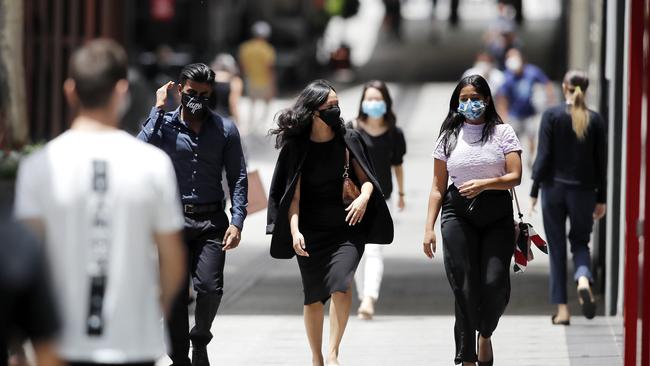 People wear face masks in Brisnane’s Queen Street Mall, on day three of the COVID-19 lockdown in Brisbane. Greater Brisbane is under a 3-day lockdown orders which are set to end at 6pm tonight after a quarantine hotel worker tested positive to the UK strain of the COVID-19 coronavirus. Picture: NCA NewsWire / Josh Woning