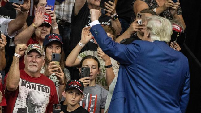 Former US president and 2024 Republican Presidential hopeful Donald Trump gestures as he leaves the stage after speaking at a rally in Rapid City, South Dakota. Picture: AFP