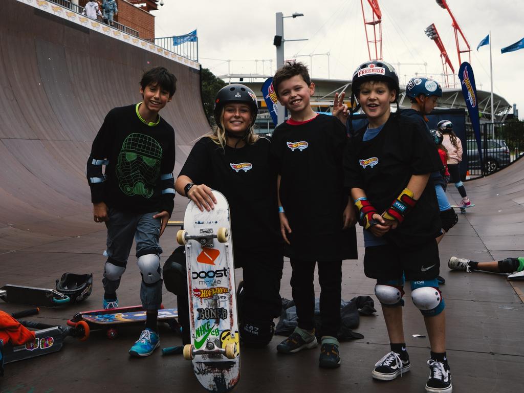 Ruby Trew and Jarryd Hughes put young skateboarders through their paces at the Monster Skatepark at Sydney Olympic Park. Picture: Ikko Ehode Arimoto