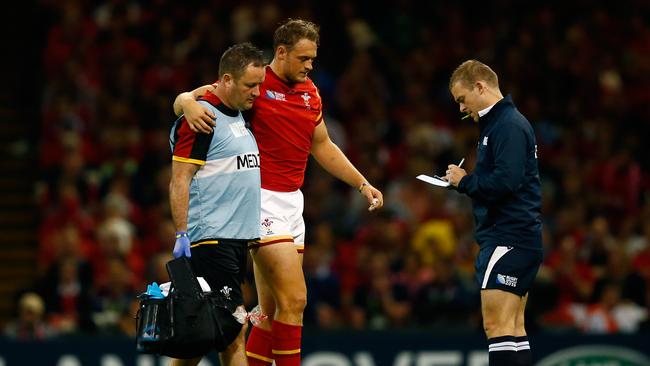 Cory Allen of Wales leaves the field injured at the Millennium Stadium.