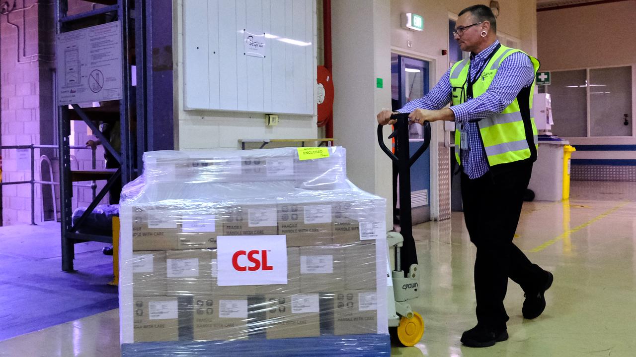 Workers at CSL roll out the first batch of the AstraZeneca vaccine last week in Melbourne, Australia. Picture: Luis Ascui/Getty Images