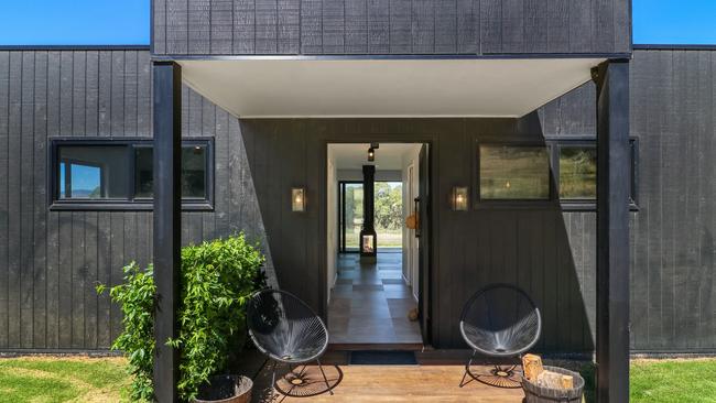 A sleek facade welcomes you to the modern home.