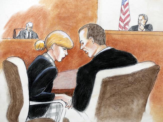 Taylor Swift, front left, confers with her lawyer as David Mueller, back left, and the judge look on during a civil trial in federal court in Denver. Picture: AP.