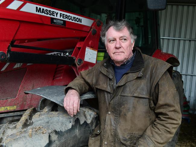 Peter Atkinson used his tractor to lift the branch off Ray Fox. Picture: Campbell Brodie.