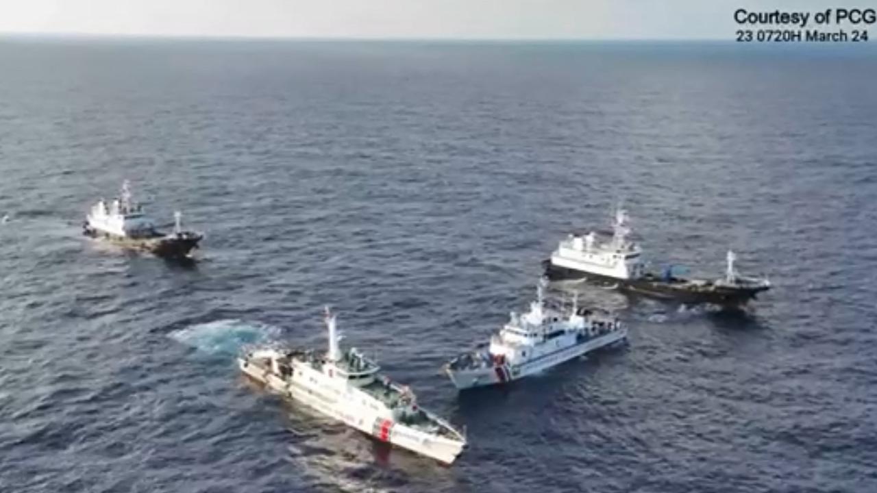Aerial video footage shows China Coast Guard ships surrounding the Philippine Coast Guard ship BRP Cabra. Picture: AFP / Philippine Coast Guard (PCG)