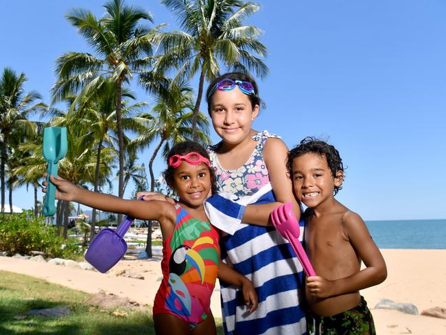 Leilani, 4, Celcelia, 9, and Zeo Billy try and cool off on the Strand. Picture: Evan Morgan