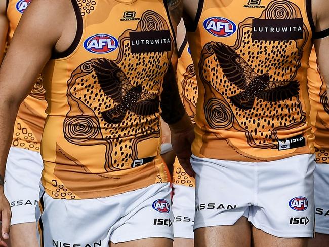 ADELAIDE, AUSTRALIA - MAY 19:  Jarman Impey and   Karl Amon of the Hawks  lead their  team out during the round 10 AFL match between Yartapuulti (the Port Adelaide Power) and Hawthorn Hawks at Adelaide Oval, on May 19, 2024, in Adelaide, Australia. (Photo by Mark Brake/Getty Images)