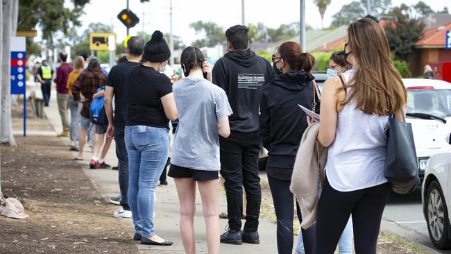 Long queues of people stretched down streets. Picture: Sarah Matray