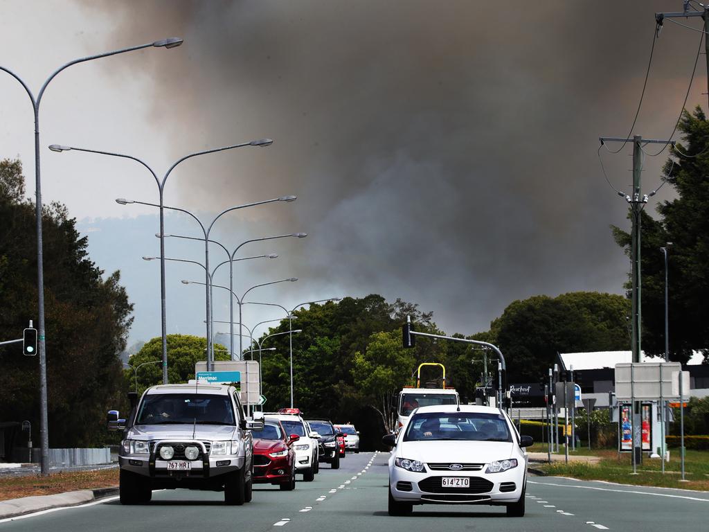 Grass Fires in the Carrara and Merrimac area kept Emergency Services and residents on alert during Tuesday. Picture Glenn Hampson