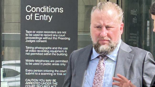 Rail Projects Victoria Metro Tunnel creative strategy lead Luke Diggins outside County Court after being released on a recognizance release order.