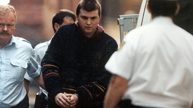 Convicted serial killer Paul Charles Denyer being escorted by police in 1995.