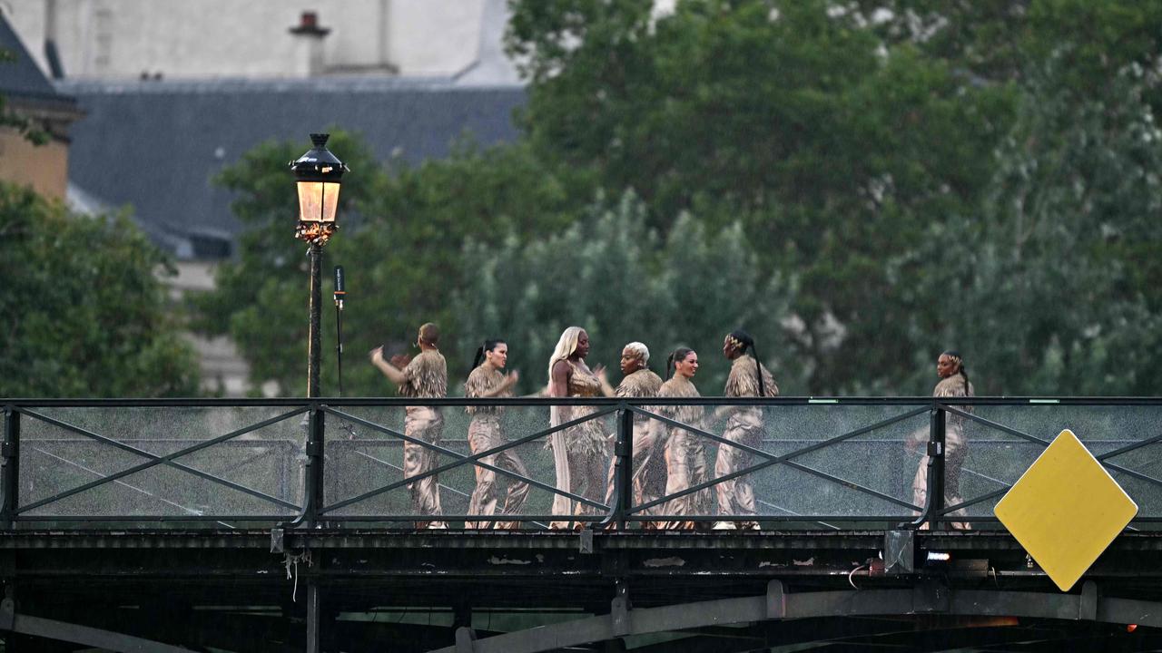 Singer Aya Nakamura performs on the Pont des Arts footbridge during the opening ceremony. Photo by Gabriel BOUYS / AFP.