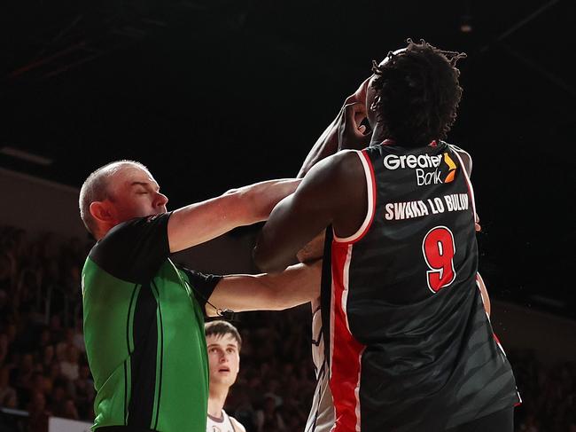 WOLLONGONG, AUSTRALIA - FEBRUARY 07: Jaylen Adams of the Kings and Wani Swaka Lo Buluk of the Hawks tussle during the round 20 NBL match between Illawarra Hawks and Sydney Kings at WIN Entertainment Centre, on February 07, 2025, in Wollongong, Australia. (Photo by Mark Metcalfe/Getty Images)